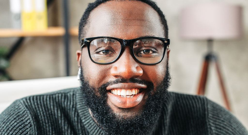 Webcam shot, african-american young guy with glasses