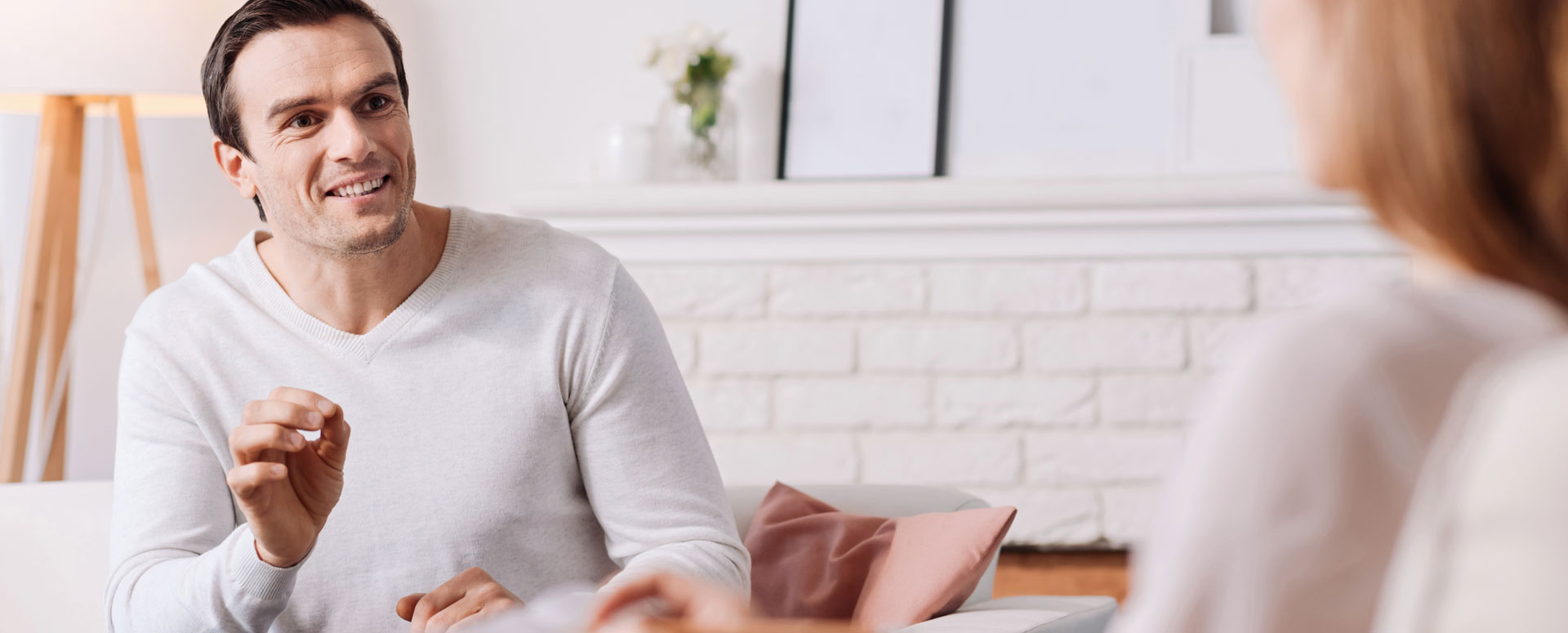 Cheerful man talking to therapist