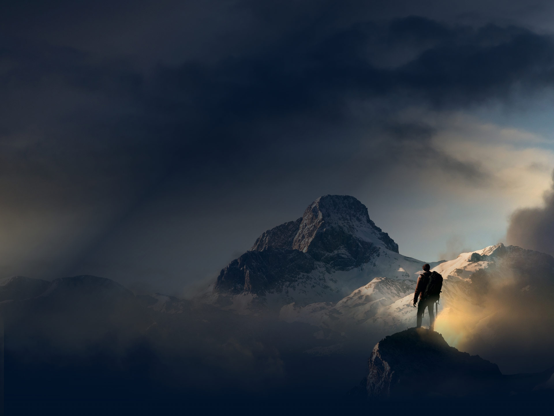 Hiker overlooking beautiful mountainscape