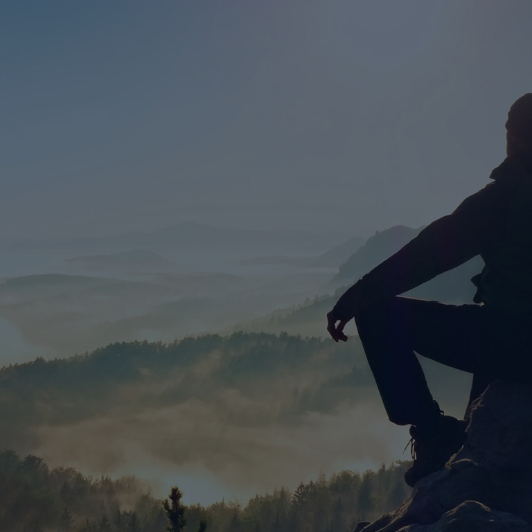 Man overlooking mountains